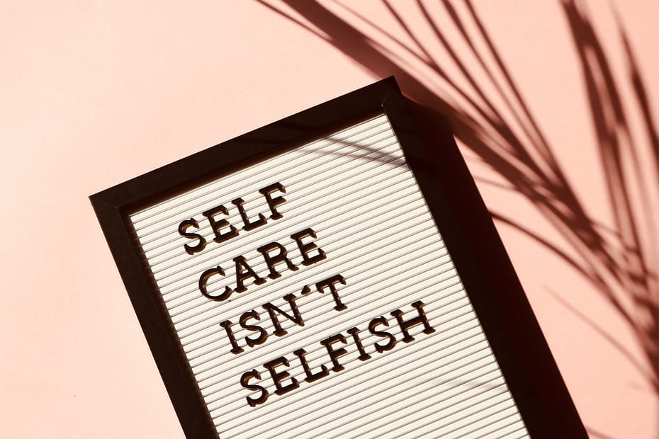 sign saying self care isn't selfish